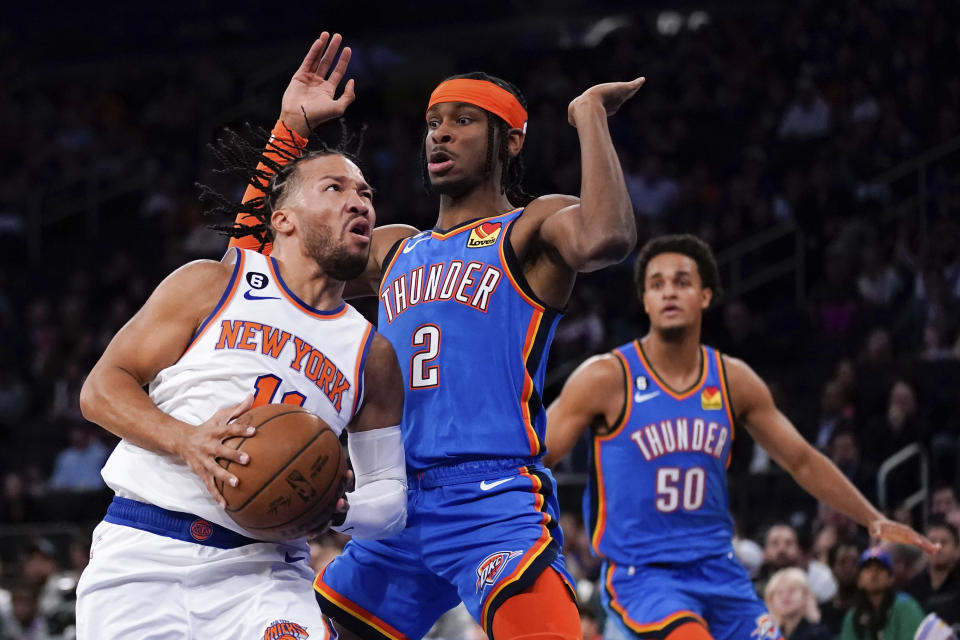 Oklahoma City Thunder guard Shai Gilgeous-Alexander (2) attempts to guard New York Knicks guard Jalen Brunson (11) during the first half of an NBA basketball game, Sunday, Nov. 13, 2022, in New York. (AP Photo/Julia Nikhinson)