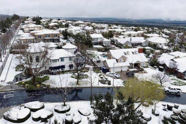 PHOTO: Snow covers homes in the Haven Estates neighborhood of Rancho Cucamonga, Calif., Feb. 25, 2023. (Josh Edelson/AFP via Getty Images)