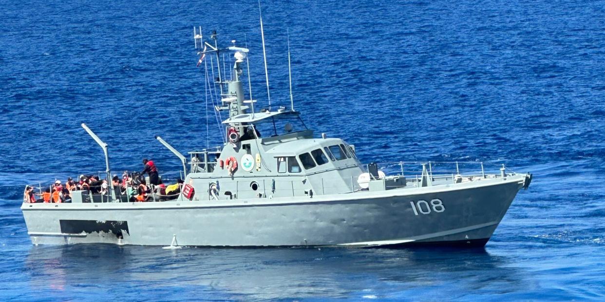 Two passengers on board the Carnival Spirit said crowds of cruisers gathered to watch the April 11 rescue mission.