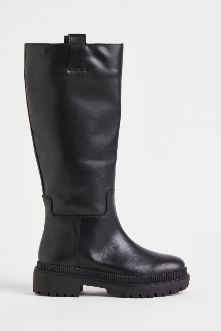 Leather Knee High Boots on a grey background