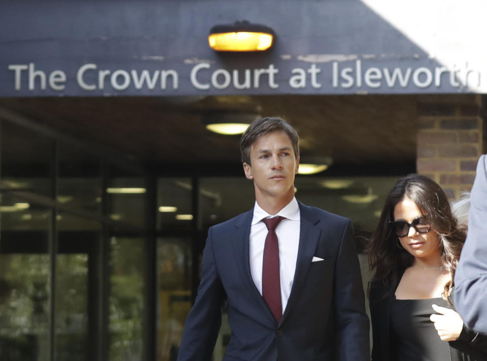Danish golfer and Ryder Cup winner Thorbjorn Olesen, left, leaves after his hearing at Isleworth Crown Court in London, Wednesday, Sept. 18, 2019, after being charged with sexual assault, being drunk on an aircraft and common assault. Olesen was arrested on 29 July after returning from the WGC St Jude Invitational on a flight from Nashville to London. Police were waiting for the 29-year-old when the aircraft landed at Heathrow. (AP Photo/Matt Dunham)