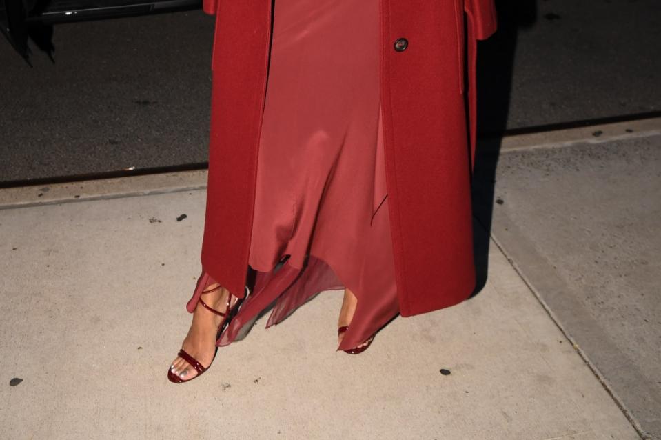 Close-up of Zoe Saldaña red shoes in New York City.