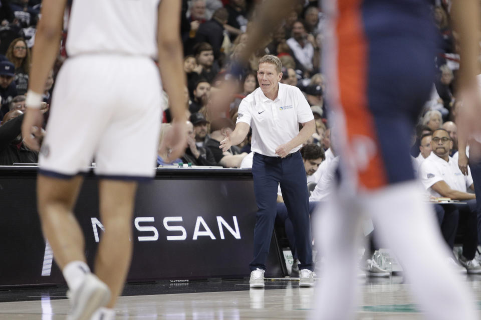 Gonzaga coach Mark Few, center, directs the team during the first half of an NCAA college basketball game against Pepperdine, Thursday, Jan. 4, 2024, in Spokane, Wash. (AP Photo/Young Kwak)