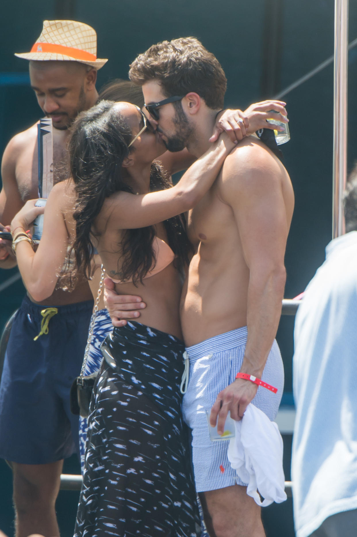 Bachelorette Rachel Lindsay and her newly fiancee Bryan Abasolo are seen at a pool party in Miami Beach. The two were joined by friends and were looking deeply in love while kissing each other under the Florida sun. <P><B>Ref: SPL1558419  190817  </B><BR/>Picture by: AM/Splashnews<BR/></P><P><B>Splash News and Pictures</B><BR/>Los Angeles:310-821-2666<BR/>New York:212-619-2666<BR/>London:870-934-2666<BR/>photodesk@splashnews.com<BR/></P>