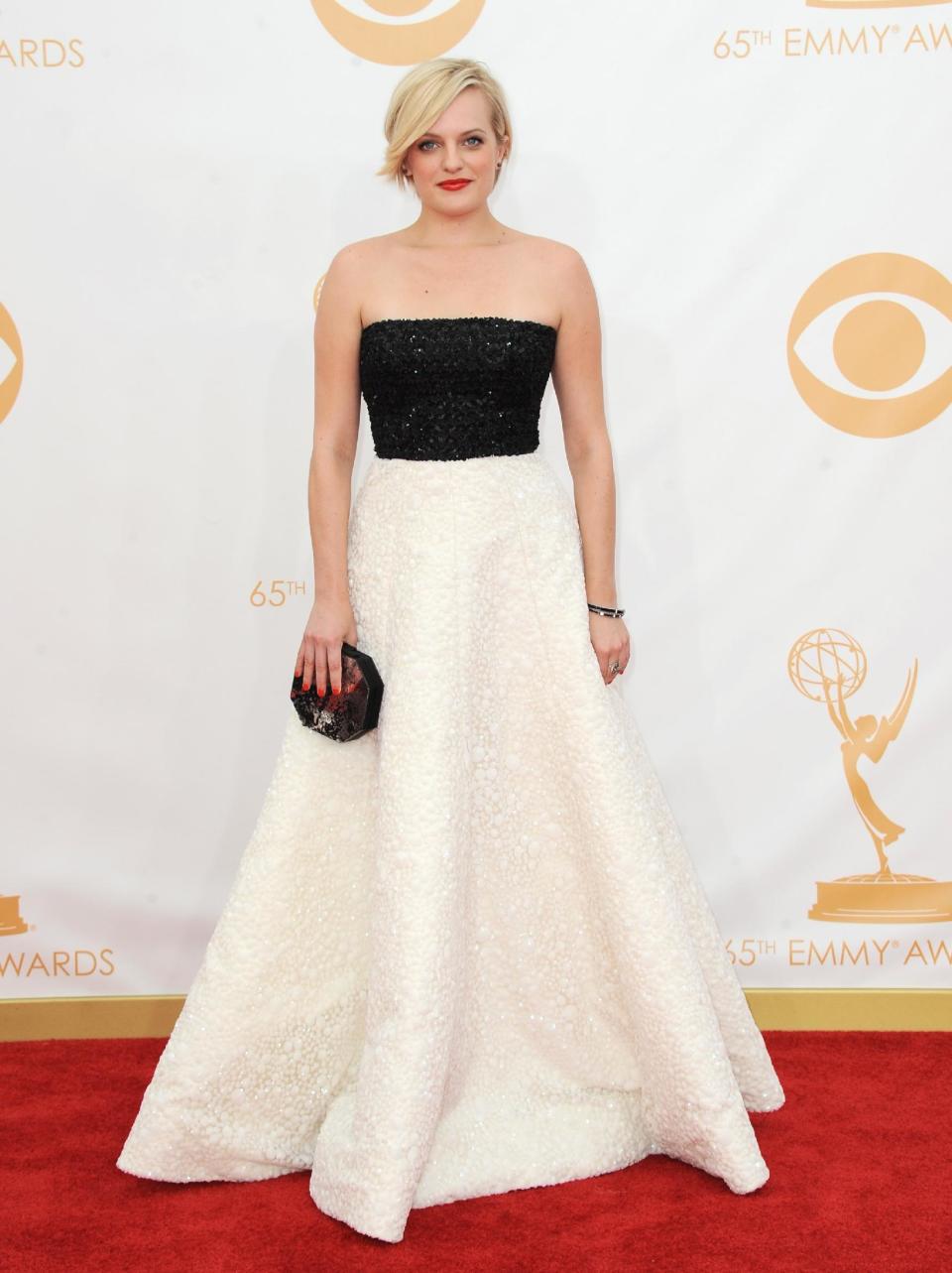 Elisabeth Moss arrives at the 65th Primetime Emmy Awards at Nokia Theatre on Sunday Sept. 22, 2013, in Los Angeles. (Photo by Jordan Strauss/Invision/AP)