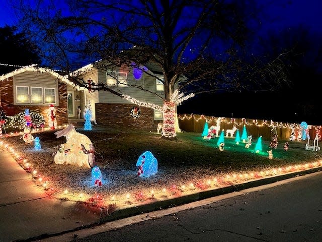 The Owens Family light display features hundreds of Christmas lights along the porch, fence and sidewalk. Lit Christmas trees, reindeer and other characters litter the front lawn too. Their home is located at 3971 N. Bannister Ave.