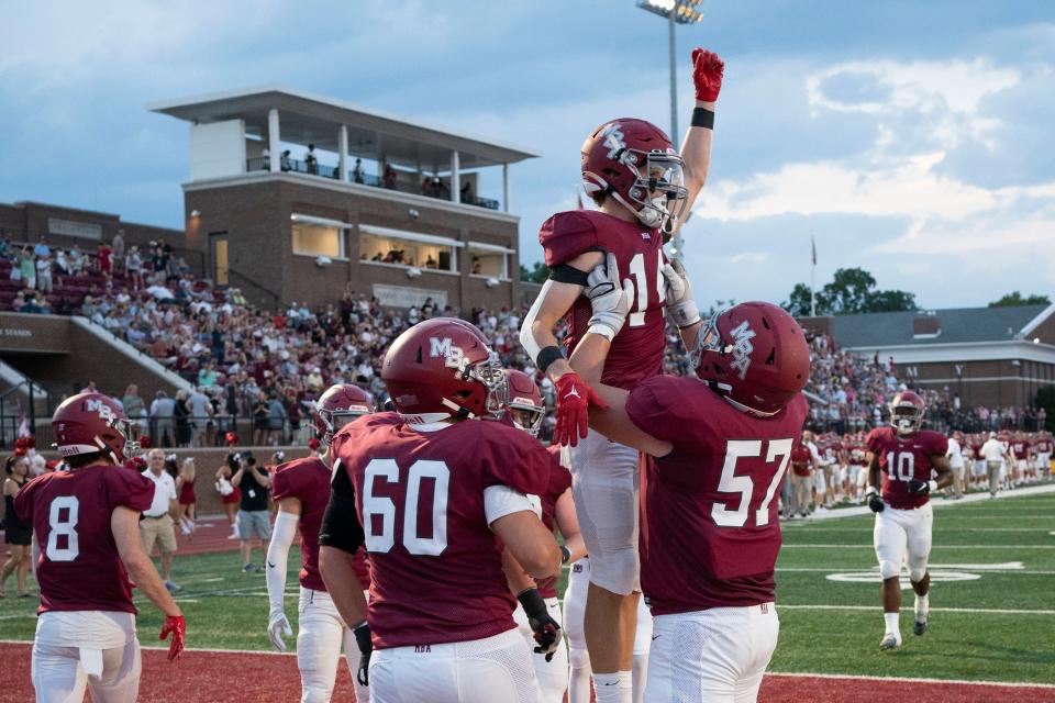MBA wide receiver Hutton Durrett (14) celebrates his touchdown against Pearl-Cohn with teammates during the first half at Montgomery Belll Academy  Friday, Aug. 26, 2022 in Nashville, Tenn. 
