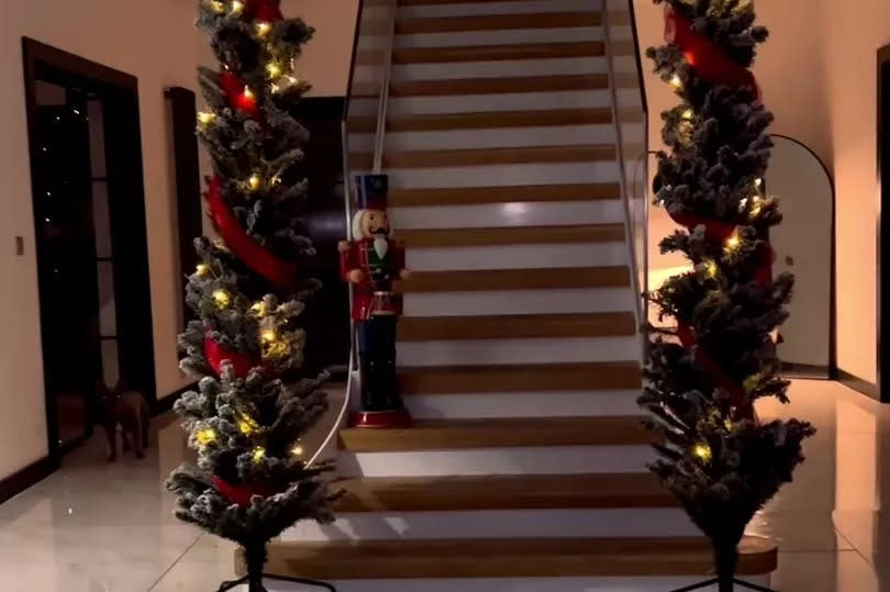 a grand staircase with garlands