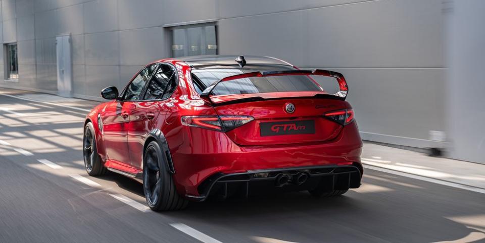 <p><a href="https://www.roadandtrack.com/new-cars/a31189421/2021-alfa-romeo-giulia-gta-gtam-pictures-specs-hp-info/" rel="nofollow noopener" target="_blank" data-ylk="slk:The GTAm;elm:context_link;itc:0;sec:content-canvas" class="link ">The GTAm</a> is the hardcore version of Alfa's sporty four-door Giulia Quadrifoglio sedan. It gets more power and a host of aero upgrades, including the massive, high-position wing you see here. Seeing such a tall piece of aero kit on a four-door might look a bit out of place, but we're into it. </p>