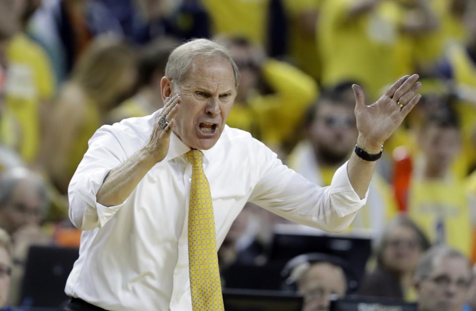 Michigan head coach John Beilein yells from the sidelines during the second half of an NCAA college basketball game against Minnesota, Saturday, Feb. 3, 2018, in Ann Arbor, Mich. (AP Photo/Carlos Osorio)