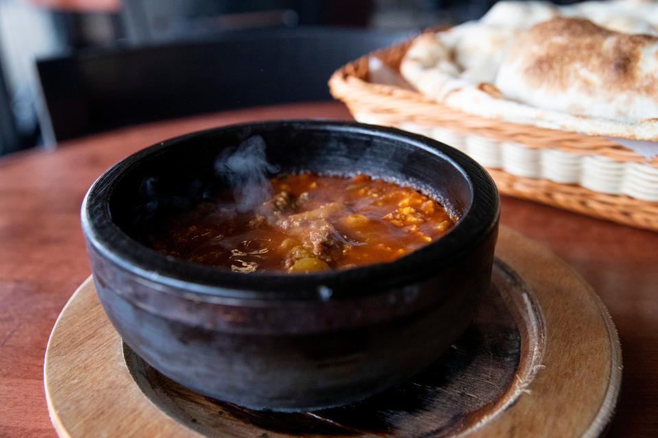 Bubbling hot saltah with beef is seen with Tandoori bread at a table in the Queen of Sheba restaurant in Cordova, Tenn., on Wednesday, March 1, 2023. 