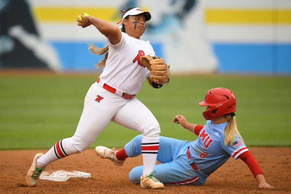 Ole Miss infielder Keila Kamoku (3) throws to first base after forcing out LMU (CA) shortstop Megan Dedrick (8) during an NCAA softball game on Friday, May 20, 2022, in Los Angeles. (AP Photo/John McCoy)