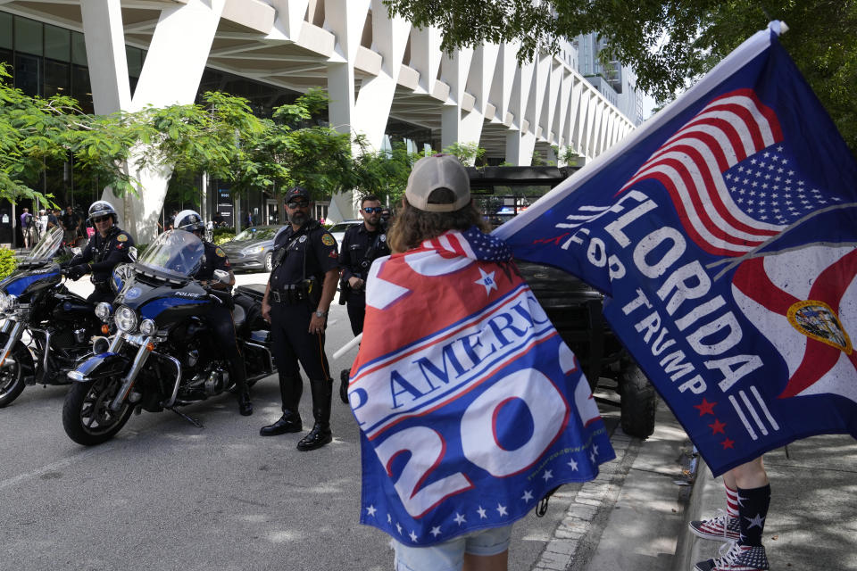 Supporters of former President Donald Trump, rally outside the Wilkie D. Ferguson Jr. U.S. Courthouse, Tuesday, June 13, 2023, in Miami. Trump is making a federal court appearance on dozens of felony charges accusing him of illegally hoarding classified documents and thwarting the Justice Department's efforts to get the records back. (AP Photo/Lynne Sladky)