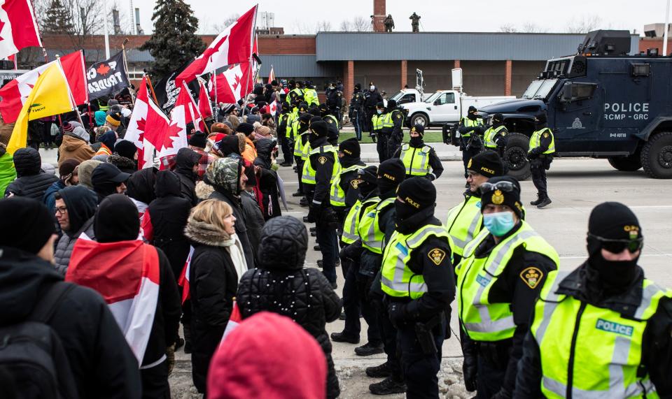 Anti-mandate protesters stand off with the police on Huron Church Road in Windsor, ON., on Feb. 12, 2022.