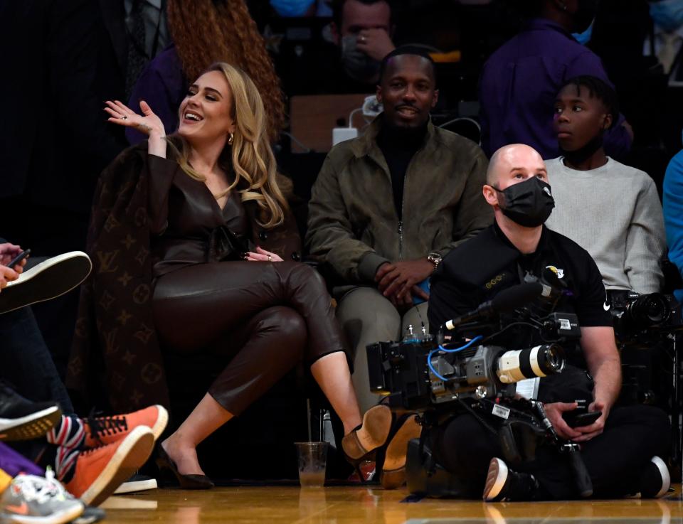 Singer Adele and Rich Paul attend a game between the Los Angeles Lakers and the Golden State Warriors at Staples Center on October 19, 2021 in Los Angeles, California.