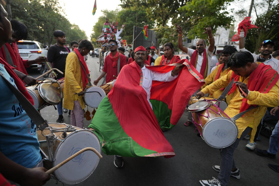 Samajwadi Party supporters dance as they celebrate their party's lead during the counting of votes in India's national election in Lucknow, India, Tuesday, June 4, 2024. (AP Photo/Rajesh Kumar Singh)