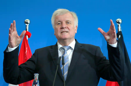 FILE PHOTO: German Interior Minister Horst Seehofer gestures as he attend a news conference in Berlin, Germany, June 13, 2018. REUTERS/Joachim Herrmann/File Photo