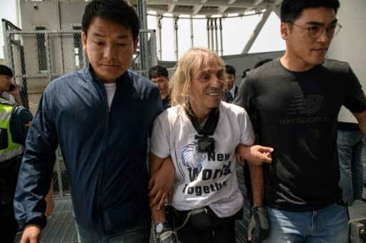 French urban freeclimber Alain Robert is arrested after being stopped during his climb of the Lotte World Tower in Seoul on June 6, 2018