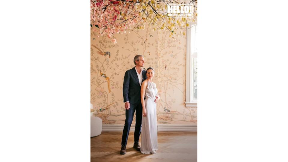 Camilla Austad Knutsen and husband John Eric Knutsen posing in Oslo home's floral room