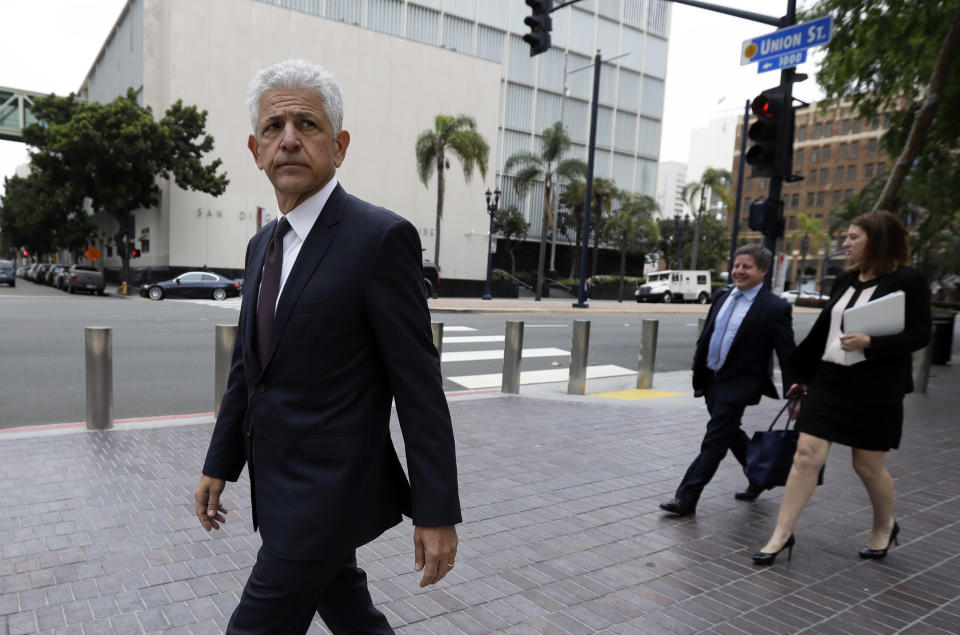 Daniel Petrocelli, lead attorney for President Donald Trump, leaves the courthouse after a hearing Thursday, March 30, 2017, in San Diego. A judge said Thursday he will issue a ruling at a later time on whether to accept an agreement for President Trump to pay $25 million to settle lawsuits over his now-defunct Trump University. (AP Photo/Gregory Bull)