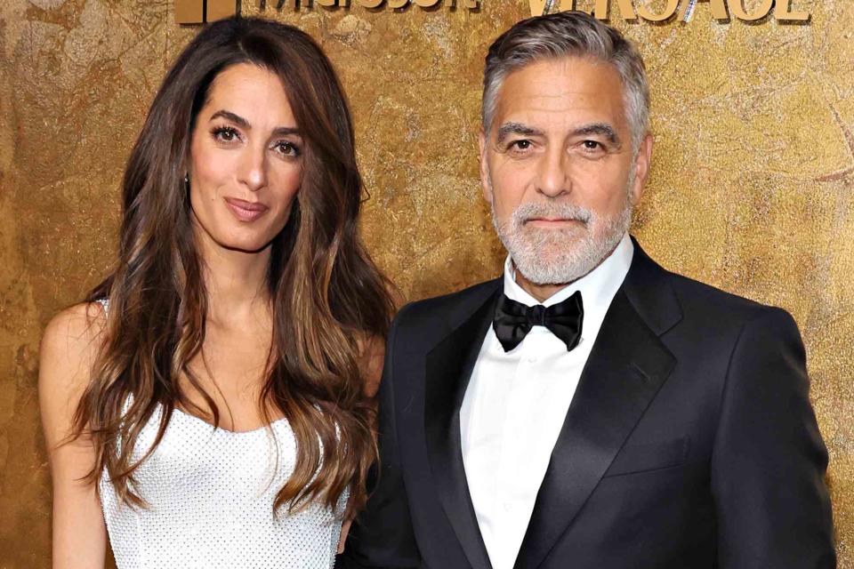 <p>Cindy Ord/Getty</p> Amal Clooney and George Clooney in New York City in 2023