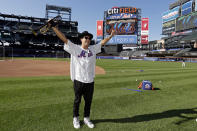 Musician Timmy Trumpet performs on the field before a baseball game between the Los Angeles Dodgers and the New York Mets on Tuesday, Aug. 30, 2022, in New York. (AP Photo/Adam Hunger)