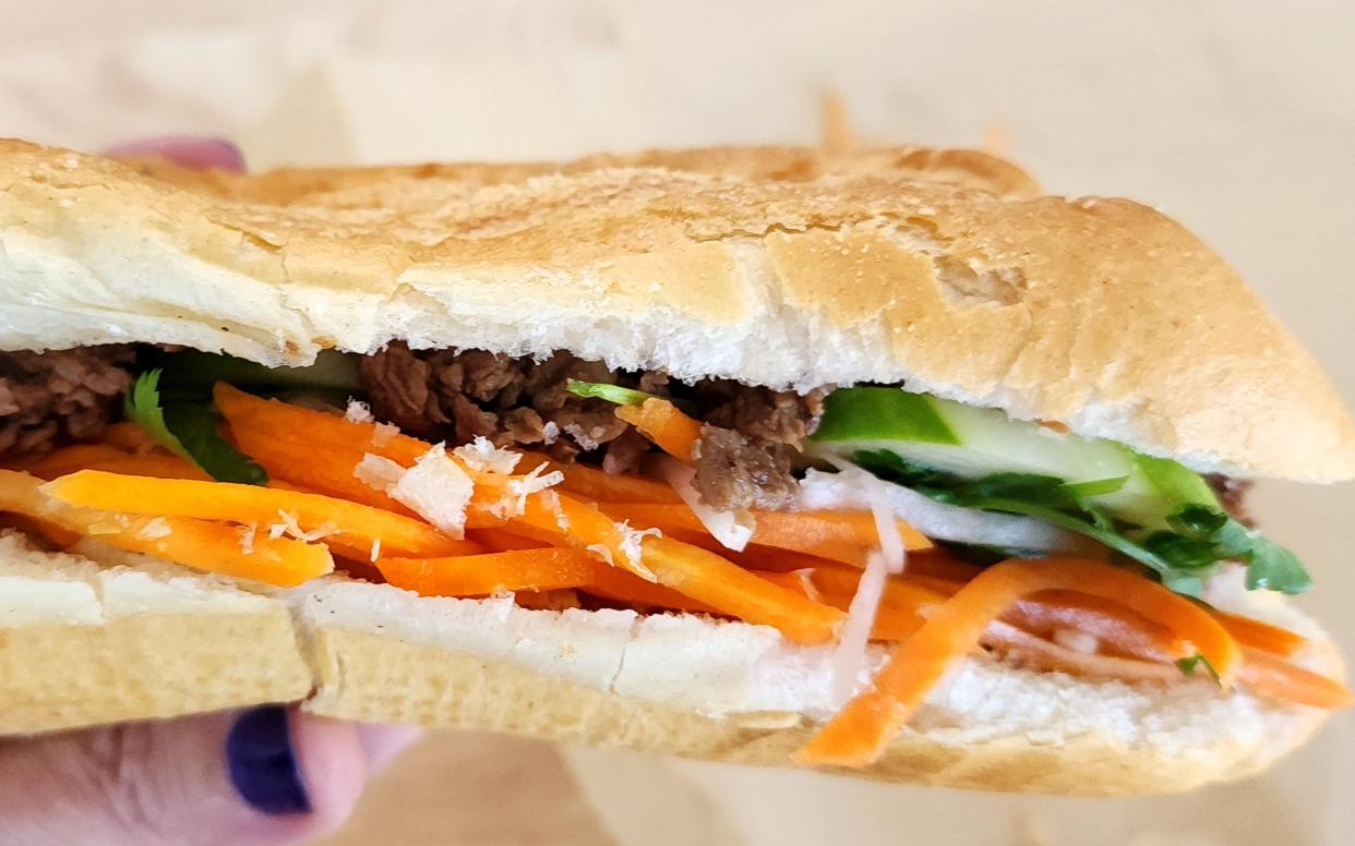 A close-up of a beef Bánh Mì at Lotus Pepper in Providence. The Vietnamese sandwich is a classic and can be ordered with tofu.