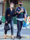 <p>Dua Lipa and boyfriend Anwar Hadid link arms while out walking in N.Y.C. on Monday. </p>