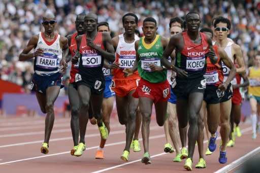 Athletes compete in the men's 5000m heats at the athletics event of the London 2012 Olympic Games. Farah remained on course for a distance double after safely negotiating his passage into the final of the 5000m