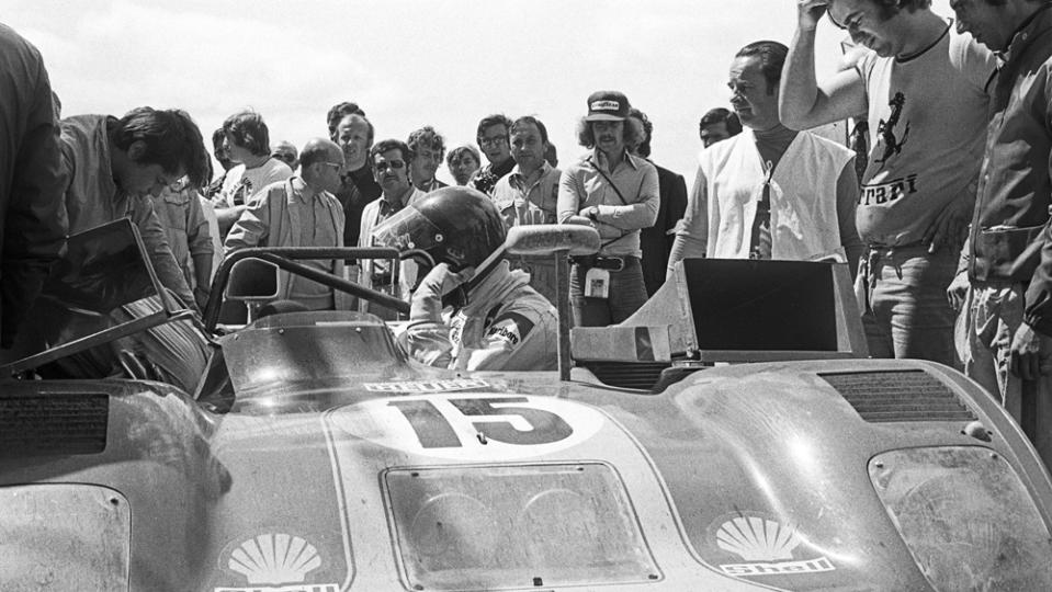 Jacky Ickx (in helmet) beside his Ferrari 312PB at the 24 Hours of Le Mans in 1973, the last year the marque competed in the race's top category until 2023.