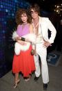 <p>Forget flower power: Embrace disco fever with an ultra-glam look ´a la Cindy Crawford and Rande Gerber. A few must-haves: faux fur, blinged-out arm candy and lots (and lots) of hair.</p>