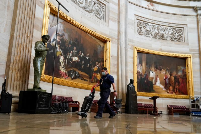 Workers setup lights in the Capitol rotunda ahead of U.S. President-elect Joe Biden's inauguration