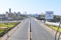 A general view of deserted roads is seen during a one-day Janata (civil) curfew imposed as a preventive measure against the COVID-19 coronavirus, in Mumbai on March 22, 2020. - Nearly one billion people around the world were confined to their homes, as the coronavirus death toll crossed 13,000 and factories were shut in worst-hit Italy after another single-day fatalities record. (Photo by INDRANIL MUKHERJEE / AFP) (Photo by INDRANIL MUKHERJEE/AFP via Getty Images)