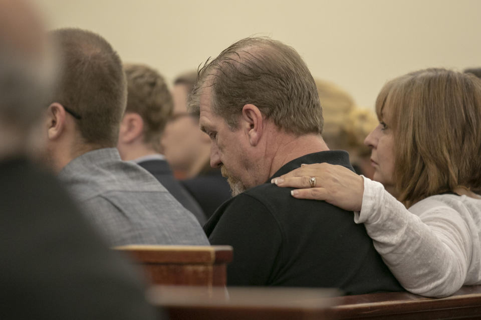 Tim Jones Sr., and his wife, Julie Jones listen as 11th Circuit Solicitor Rick Hubbard delivers closing arguments, pushing for the death penalty, during the sentencing phase of the trial of Timothy Jones Jr. in Lexington, S.C. on Thursday, June 13, 2019. Jones, Jr. was found guilty of killing his five young children in 2014. (Tracy Glantz/The State via AP, Pool)