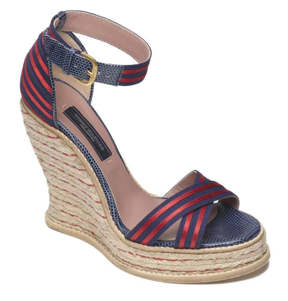 This product image released by Tommy Hilfiger shows a red and blue striped espadrille wedge. The rope-soled shoes have long been a staple of the fair-weather seasons, no matter if there's a chill in the air or the sidewalks are steaming. It's all good as long as the sun is shining. (AP Photo/Tommy Hilfiger)