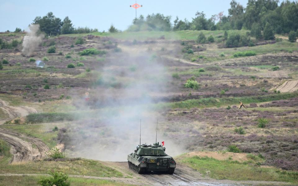 Ukrainian soldiers train to use a Leopard 1A5 main battle tank during a media day of the European Union Military Assistance Mission