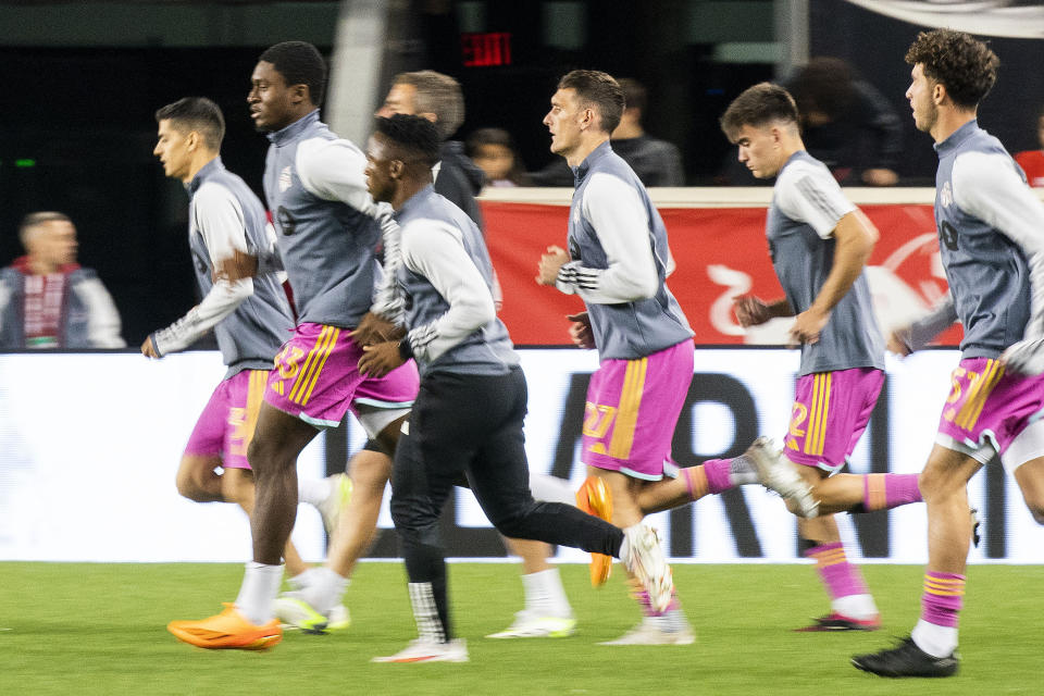 Toronto FC players warm up before an MLS soccer match against the New York Red Bulls, Saturday, Oct. 7, 2023, in Harrison, N.J. (AP Photo/Eduardo Munoz Alvarez)