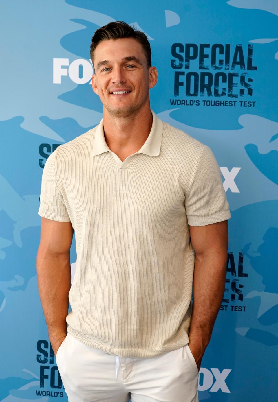 "The Bachelorette" star Tyler Cameron, a cast member on Season 2 of "Special Forces: World's Toughest Test," poses at a red carpet event for the series at Fox studios on Tuesday, Sept. 12, 2023, in Los Angeles.