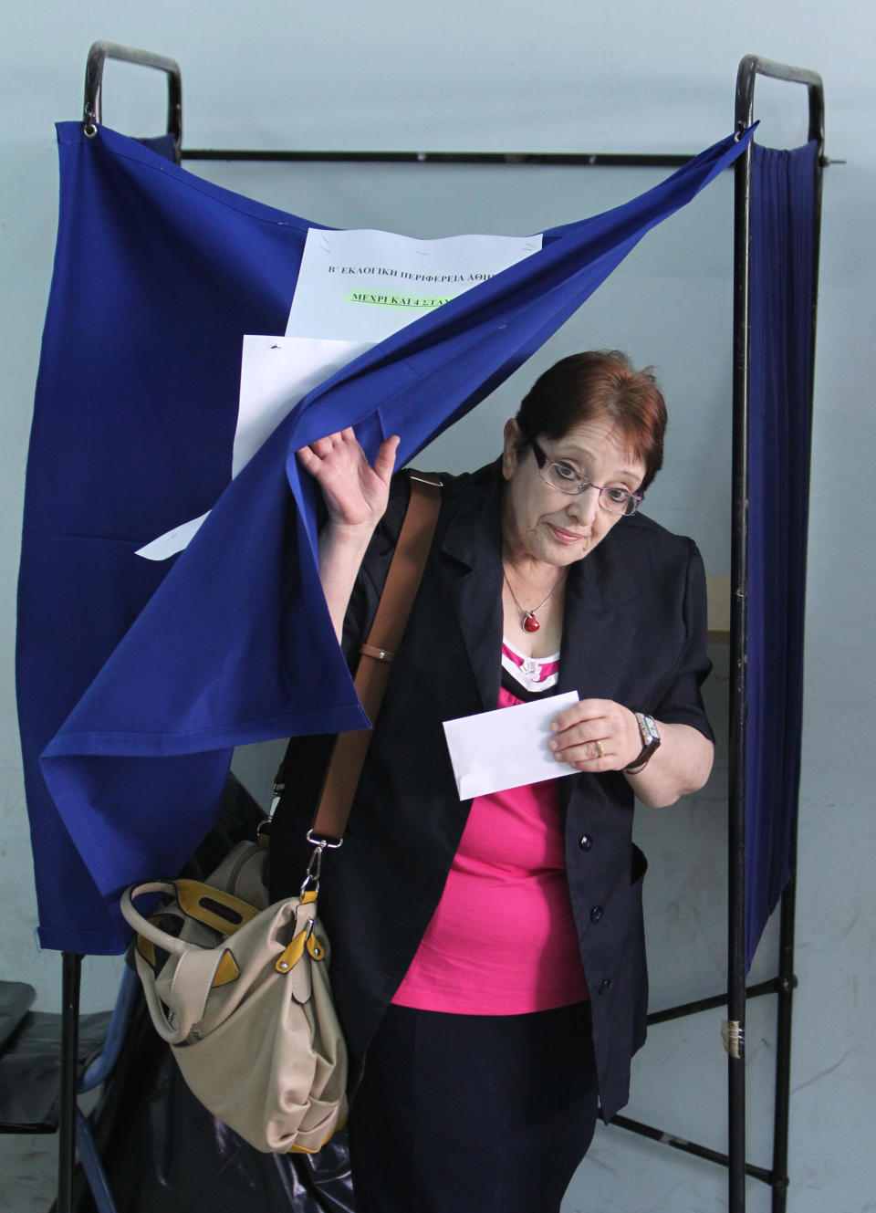 Leader of the Greek Communist Party Aleka Papariga votes at a polling station in Athens, Sunday, May 6, 2012. Greeks cast ballots on Sunday in their most critical _ and uncertain _ election in decades, with voters set to punish the two main parties that are being held responsible for the country's dire economic straits. (AP Photo/Thanassis Stavrakis)