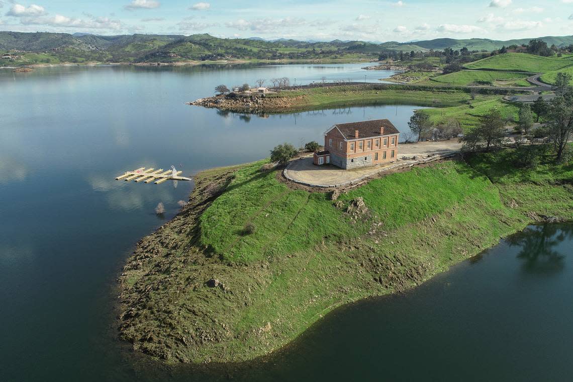 The Historic Millerton Courthouse sits above Millerton Lake in Friant where lake levels have reached more than 80 percent-full following several atmospheric river events, on Wednesday, Jan. 18, 2023. Last year at this time the lake was at 56 percent of capacity.