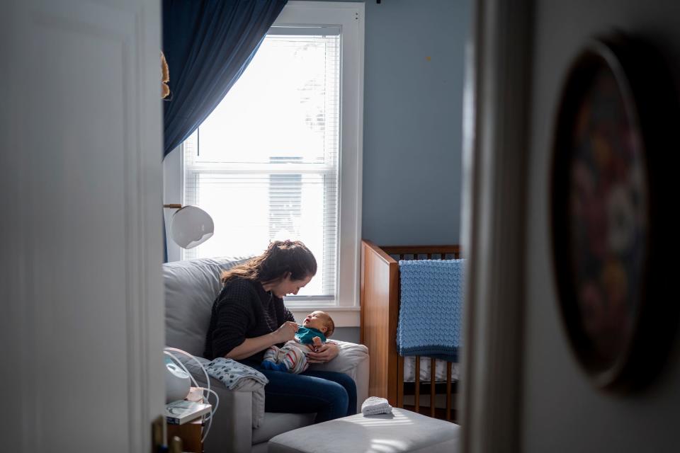 Corinne Rockoff, left, of Ferndale, feeds her son Sawyer Basin while sitting in his room at their home in Ferndale on Jan. 27, 2023.