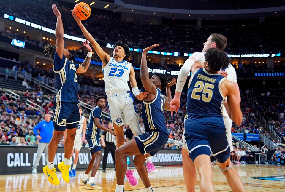 Creighton Bluejays guard Trey Alexander (23) shoots the ball against Akron Zips guard Greg Tribble (2) in the first round of the 2024 NCAA Tournament at PPG Paints Arena in Pittsburgh on Thursday.