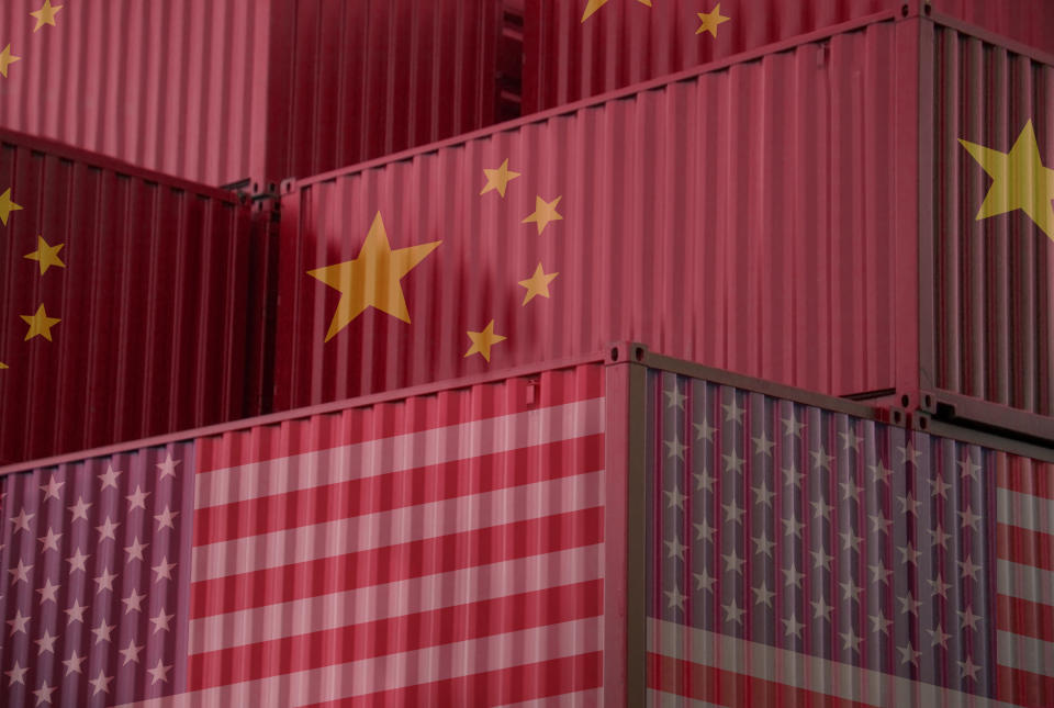 Cargo containers with China and united States flag in the harbor.