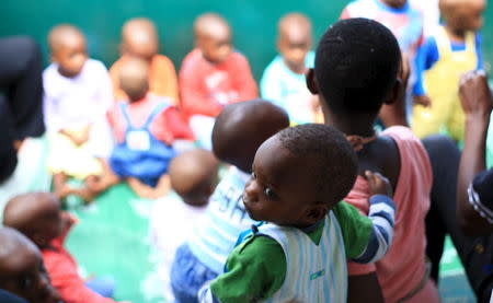 Abandoned children are seen during a group singing session at a home in Uganda's capital Kampala May 14, 2015. REUTERS/James Akena