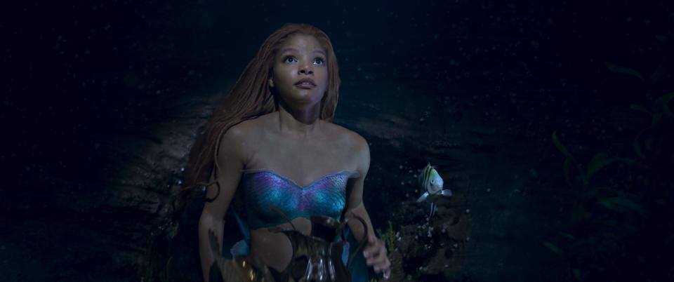 Ariel (Halle Bailey) yearns to explore a world outside her watery home in "The Little Mermaid," a live-action redo of the 1989 Disney animated classic.