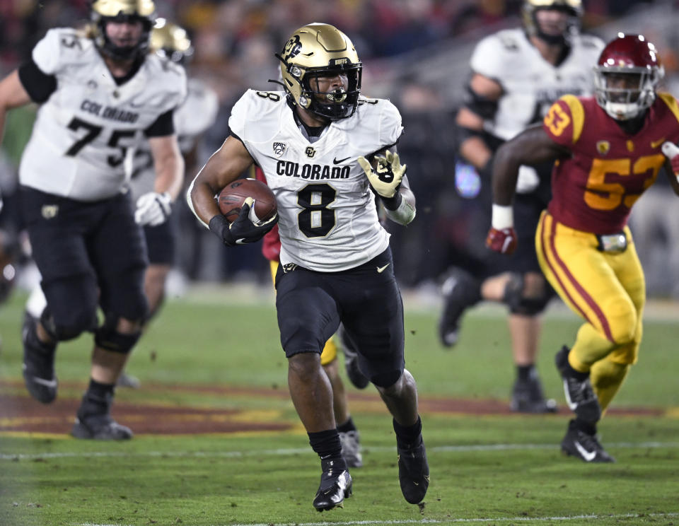 Colorado running back Alex Fontenot carries against Southern California during the first half of an NCAA college football game Friday, Nov. 11, 2022, in Los Angeles. (AP Photo/John McCoy)