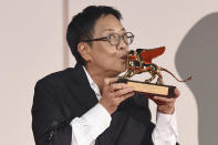 Director Ann Hui holds her Golden Lion award for Lifetime Achievement during the 77th edition of the Venice Film Festival in Venice, Italy, Tuesday, Sept. 8, 2020.(Piergiorgio Pirrone /LaPresse via AP)