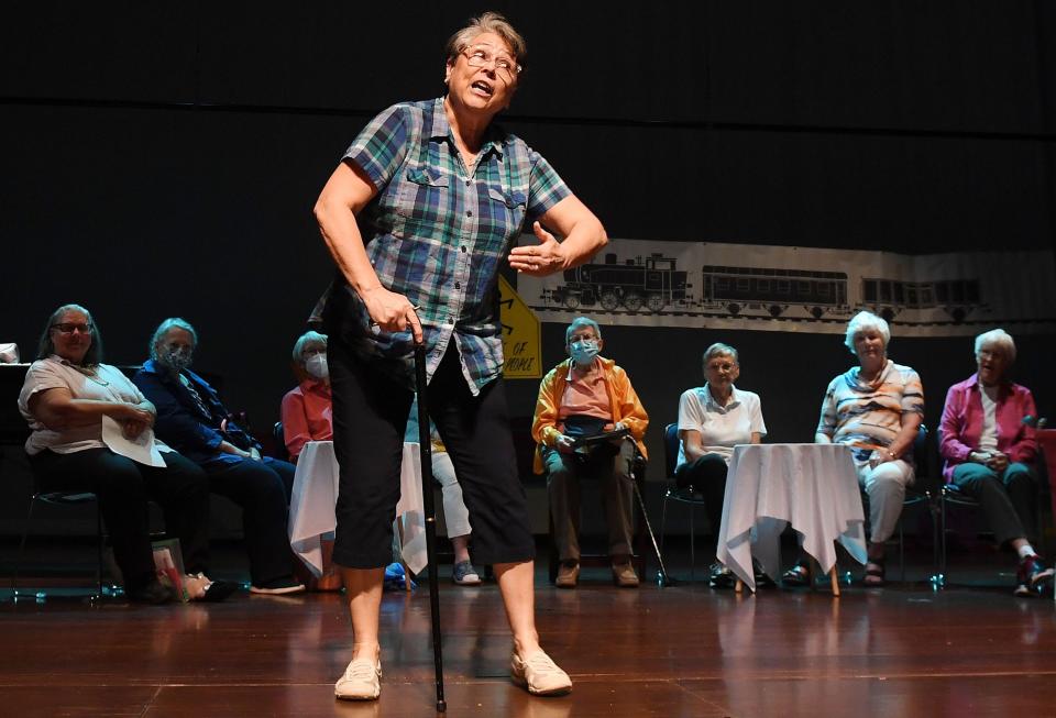 Cathy VanBrocklin performs with the Green Birds chorus during the Senior Variety Show rehearsal at Ames City Auditorium on Monday in Ames.