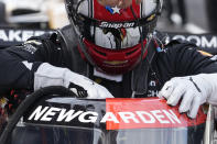 Josef Newgarden climbs into his car during practice for the IndyCar Grand Prix auto race at Indianapolis Motor Speedway, Friday, May 12, 2023, in Indianapolis. (AP Photo/Darron Cummings)