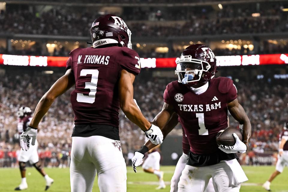Sep 2, 2023; College Station, Texas; Texas A&M Aggies wide receiver Evan Stewart (1) celebrates with teammate wide receiver Noah Thomas (3) after his touchdown during the third quarter New Mexico Lobos at Kyle Field. Maria Lysaker-USA TODAY Sports